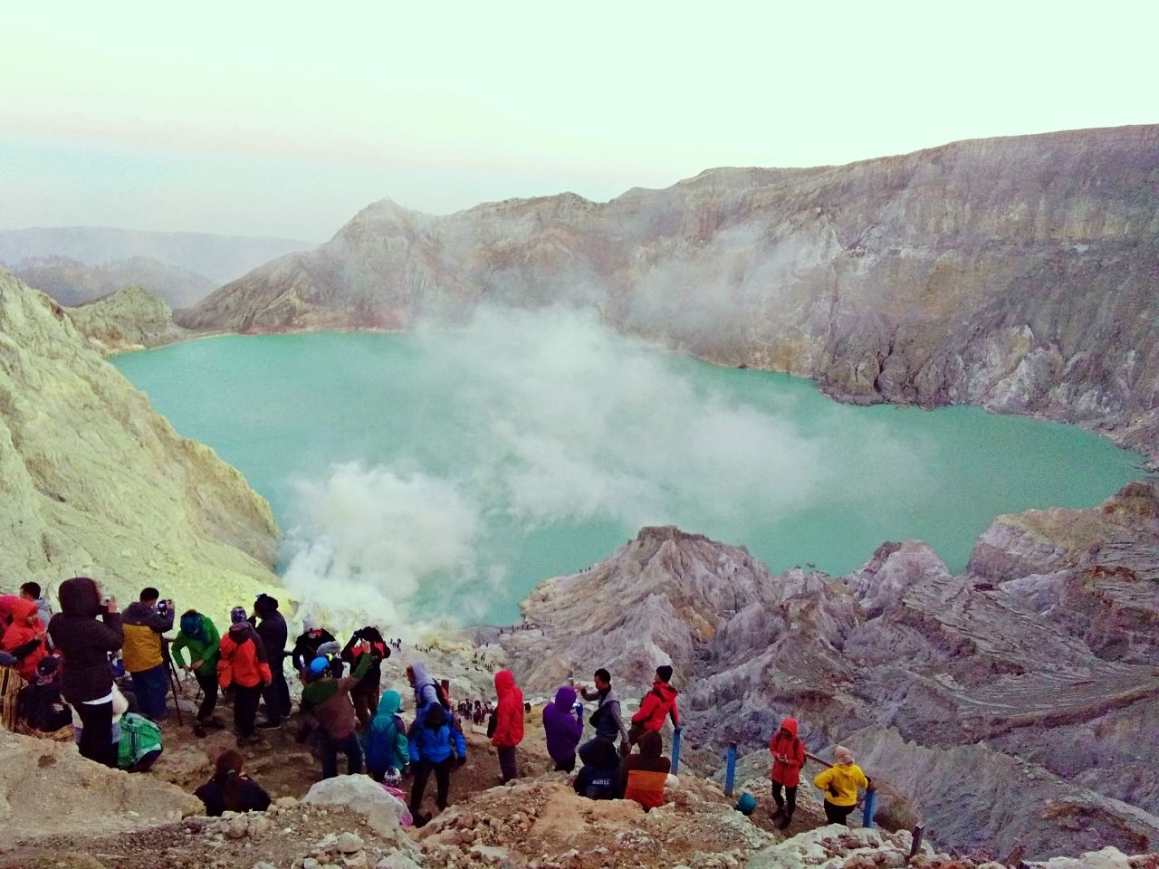 Tourists crowd at the crater