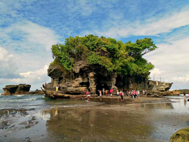 When the tide is low, visitors can simply walk to the temple.