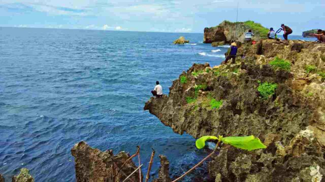 fishing at the edge of the cliff