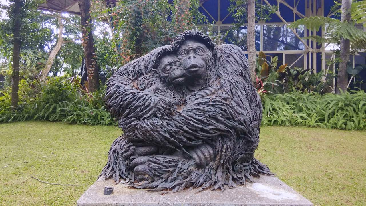 baby orang utan with mother orang utan sculpture