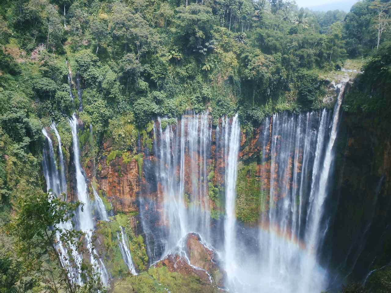 rainbow at coban sewu waterfall 