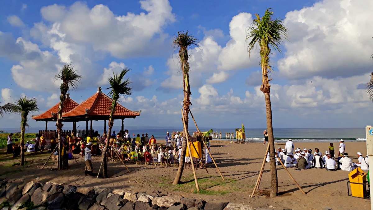 Religious ritual ceremony in petitenget beach 