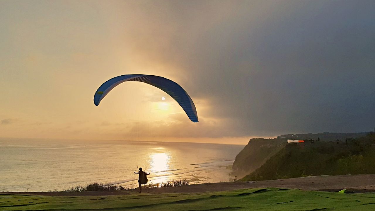 paragliding during sunset 