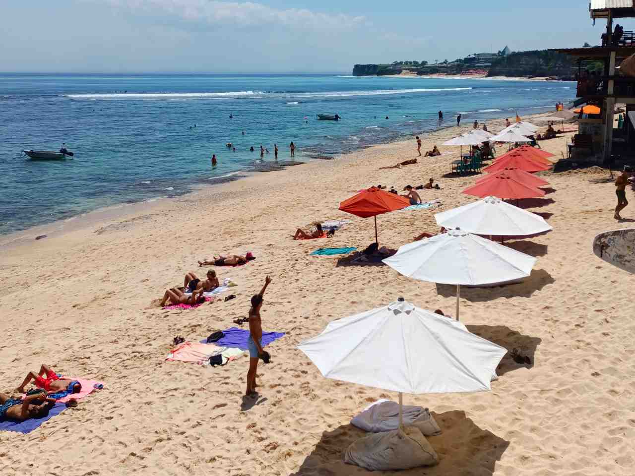 surfing and sunbathing in the beach