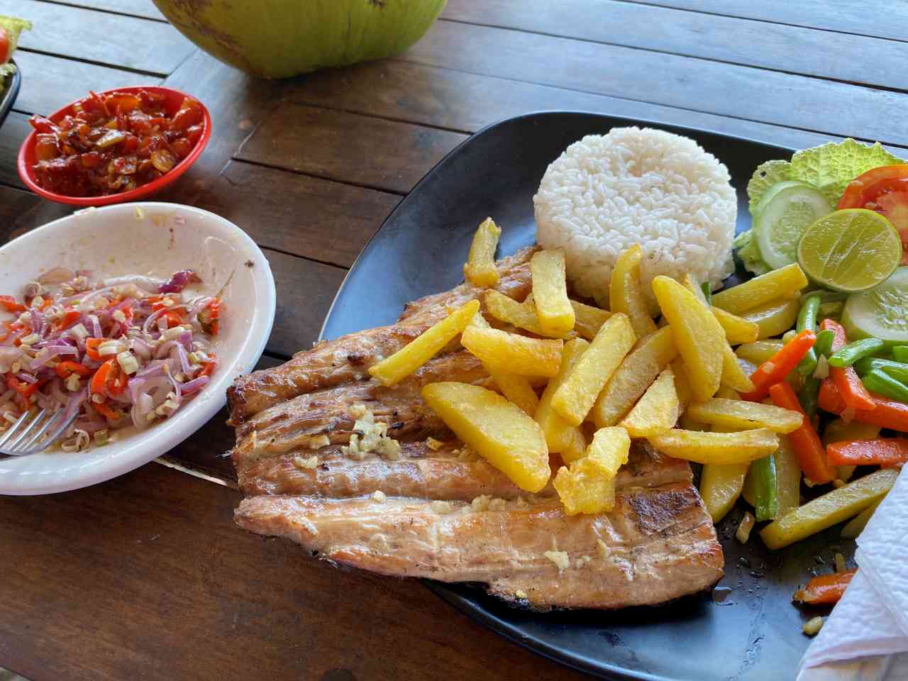 grilled fish at locals warung in virgin beach 