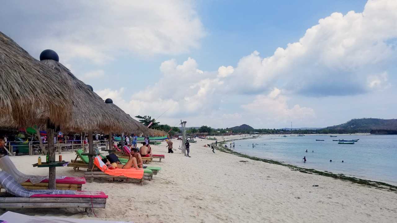 Tanjung Aan beach features white sand and long shoreline. 