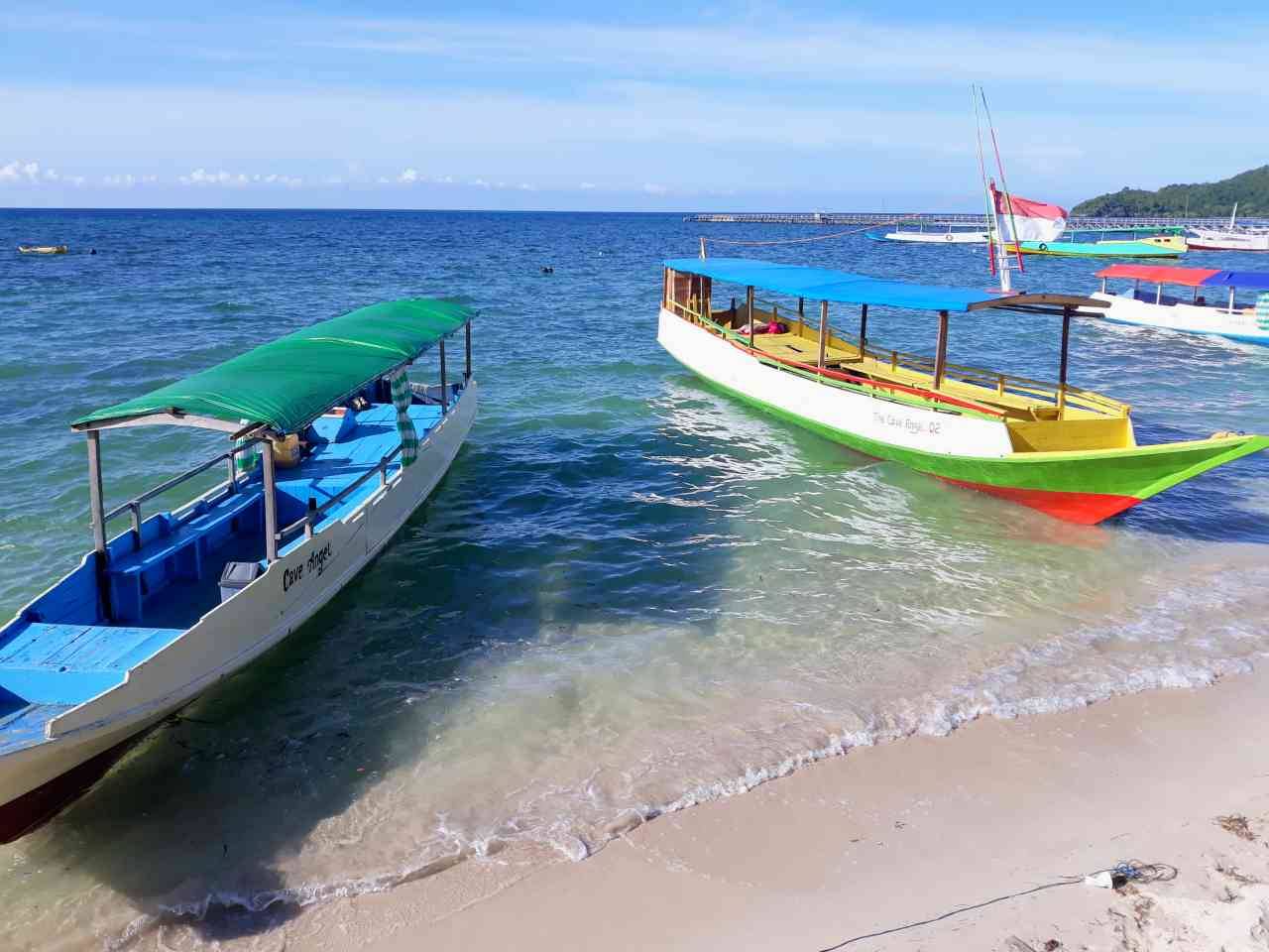 small boats docking in the beach. 